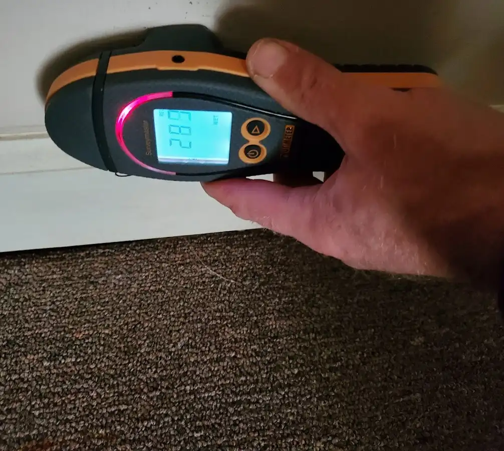 Moisture detection at baseboard during Burst Pipe Cleanup in Haysville